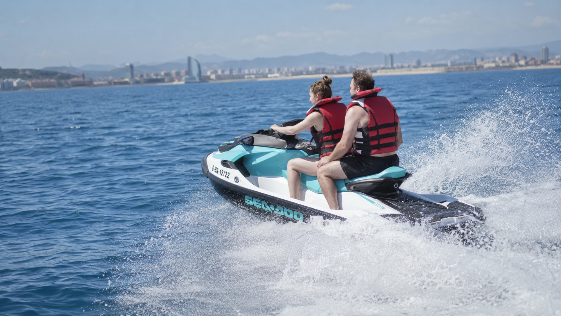 Couple enjoying a fast jet ski ride in Barcelona